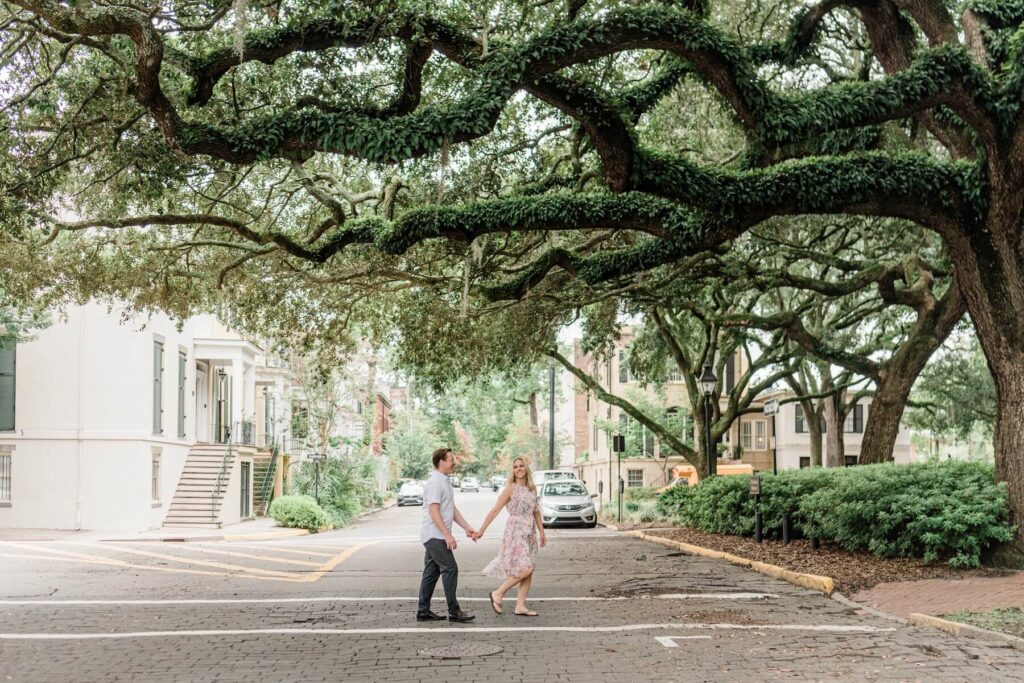 A couple walking down the street in Savannah, Georgia, one of the most European cities in North America on a photoshoot with Flytographer