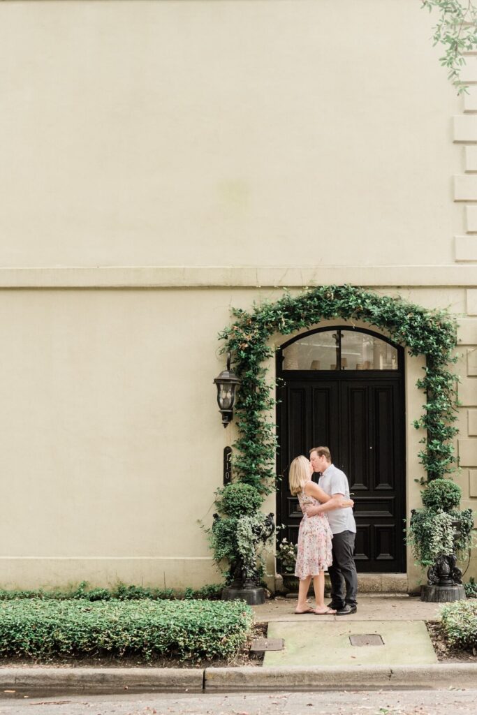 A couple walking down the street in Savannah, Georgia, one of the most European cities in North America on a photoshoot with Flytographer