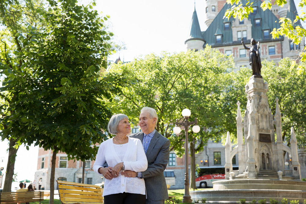 Mature couple holding each other in a park in Quebec City, Quebec Canada